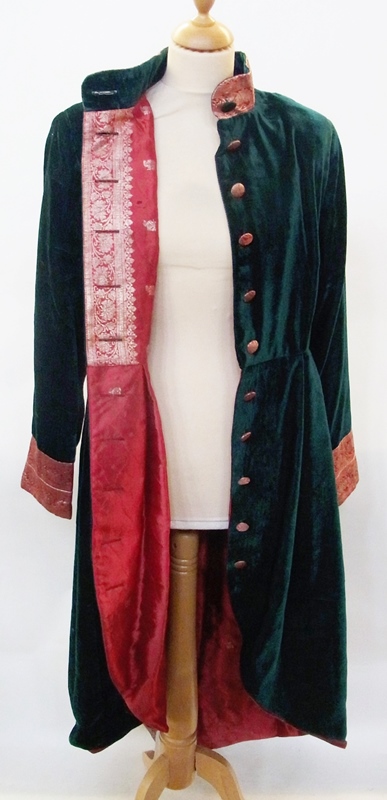Green velvet evening coat, the lining, mandarin collar, half belt, cuffs and buttons covered in sari