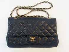 Vintage Chanel quilted bag, gilt metal fastening with the Chanel logo, chain and plaited leather