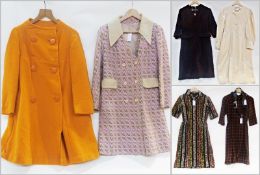 A 1960's double breasted collarless orange woollen coat, an early 1970's pink and beige double