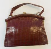 Brown fixed frame alligator bag, with gilt metal fastening and frame, internal purse