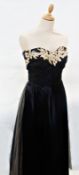 A 1950's black satin and net evening dress, fitted sleeveless bodice with embroidery, silvered