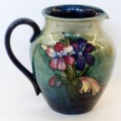 Moorcroft pottery jug, tubeline decorated in the anemone pattern, marked "W. Moorcroft" to base,
