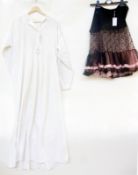 A Victorian nightgown, pintucks, the collar bordered with lace and a 1950's black and pink net