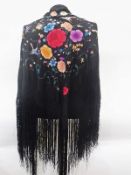 Oriental black embroidered shawl, floral and bird decorated, with deep tasselled fringe