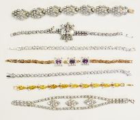 Various vintage and later diamante/paste bracelets and a gilt coloured metal bracelet with paste