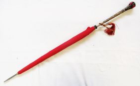 Red umbrella with a metal handle, with moulded leaves, set with red-coloured glass stones and with a