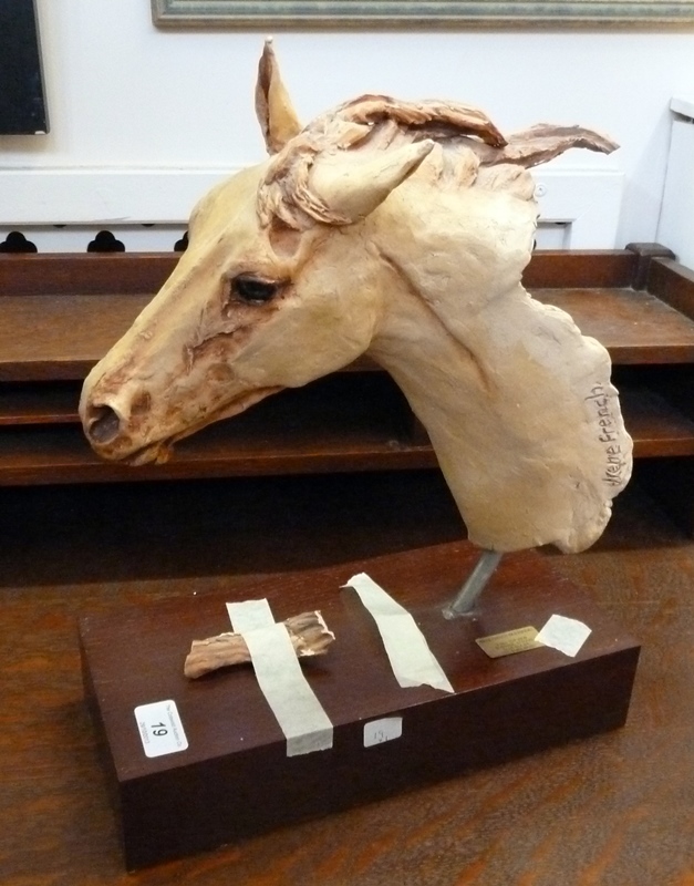 Plaster sculpture of a horse's head, signed Irene French on the neck, set on a wooden plinth, (