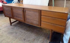 1960s A. H. McIntosh & Co. sideboard, comprising three panelled cupboards and three short drawers to