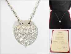 WITHDRAWN

Cartier 18ct white gold, diamond set, heart-shaped pendant, 1cm high, and the matching
