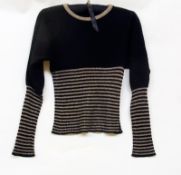 A (Biba) black and gold wool batwing sleeved jumper, label missing, with two black Biba bags (3)