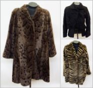 A faux fur coat, circa 1980's, giraffe print, a fun faux fur coat by "Suziklo", zebra print and a