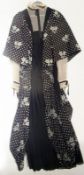 A Gini Frantini black and white crape evening dress, angel sleeves over cream pin-tucked sleeves,