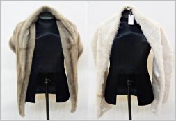 A grey mink stole (a few marks) together with a white faux fur stole (2)