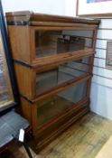 Twentieth century Globe Wernicke oak bookcase, three tiers, with label to inside, on plinth base,