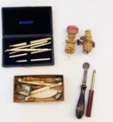 Various bone crochet hooks, small button hooks, silver-coloured metal thimbles, bone fish needle