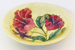 Moorcroft pottery bowl, decorated in the hibiscus pattern, tubelined in yellow ground, 24cm