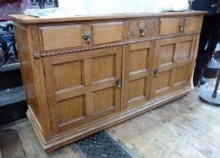 Waring & Gillow Ltd. oak sideboard, three short drawers to top with panelled cupboards below, with