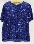 A blue sequined evening top