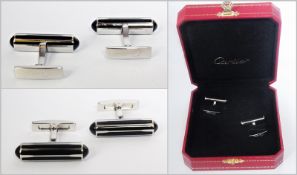 Pair Cartier silver, black lacquer and black onyx gentleman's cufflinks, each baton style with bands