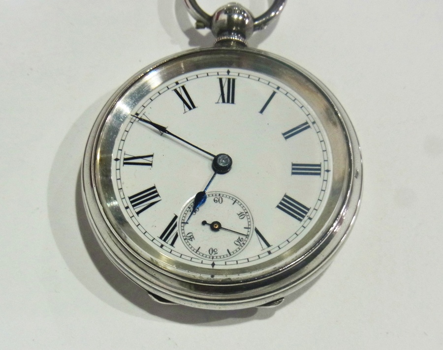 A small silver cased open face pocket watch with enamel dial and second subsidiary dial,