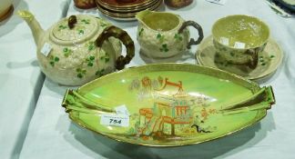Carlton Ware oval-shaped dish green ground decorated with pagoda and a Belleek tea service to
