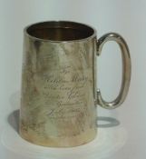 A silver mug of tapering cylindrical form, Birmingham 1904, height 8cms