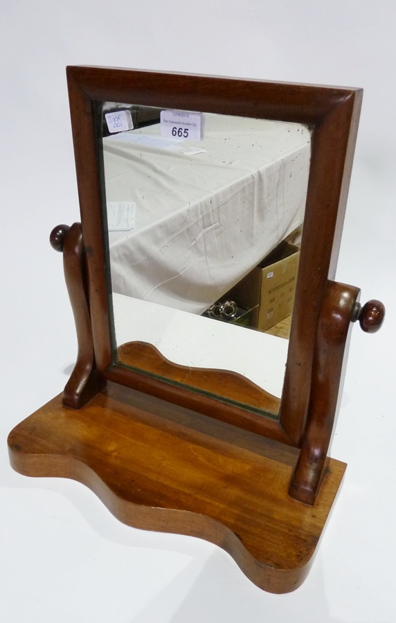 Mahogany rectangular swing frame mirror, on wavy base, and a box with cutlery