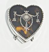 An Edwardian silver pique heart-shaped jewellery box, with inlaid tortoiseshell cover, raised on