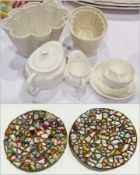 Jelly moulds, Royal Crown Derby matched solitaire teaset and 2 circular plates decorated with