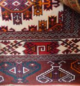 Modern Persian wool carpet, the cream ground with geometric lozenge medallions, key and hooked