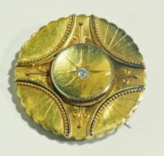 Victorian gold and diamond brooch, circular, with scalloped and fan borders, bead and filigree