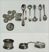 A small collection of silver items to include a vesta case, napkin ring, two coffee spoons etc and a