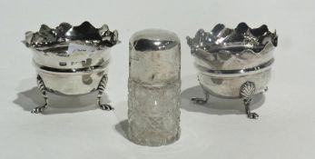 A pair of silver open salts with wavy borders, raised on pad feet, Birmingham 1977, a three