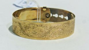 Silver gilt adjustable bangle, foliate scroll engraved