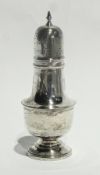 Silver sugar sifter of cylindrical form raised on a circular foot, Sheffield 1947, height 19cms, 5
