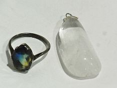 Silver and cut stone ring, the stone blue and yellow shaded, and a crystal type pendant