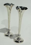 Pair of silver trumpet-shaped vases raised on a circular foot, Birmingham 1906, height 19cms
