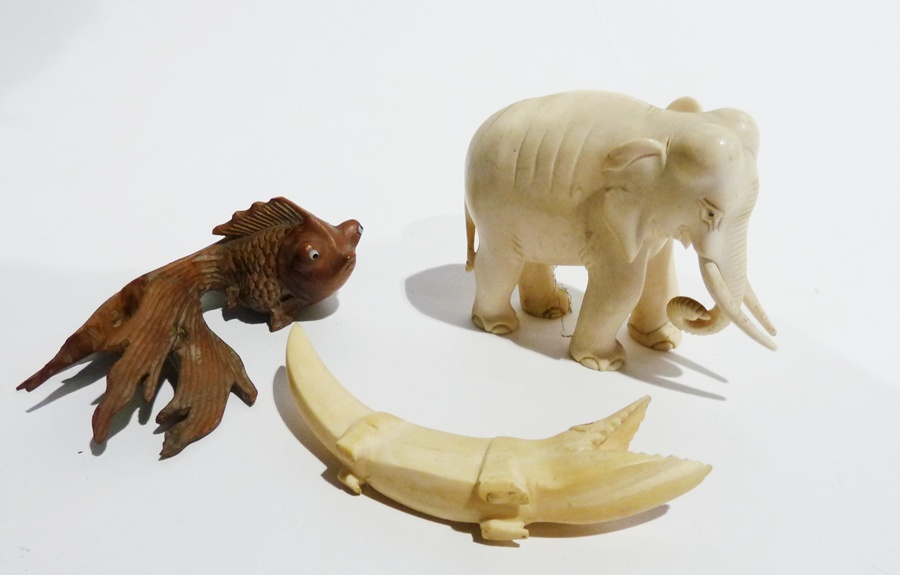 Carved ivory elephant and five other animal models including:- fish (6)
