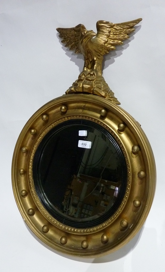 Regency style wall mirror, circular with eagle surmount