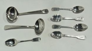 A pair of Georgian silver bead pattern gravy ladles, London 1811, five silver teaspoons, various