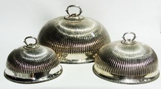 Set of three graduated EPNS meat domes, oval, ribbed and having twin C-scroll handle, gadrooned
