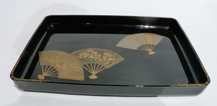 Black lacquer tray, decorated in gilt, silver and coloured fans, in original box, with maker's