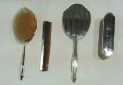 Silver backed dressing table set comprising hairbrush, hand mirror, clothes brush and comb with