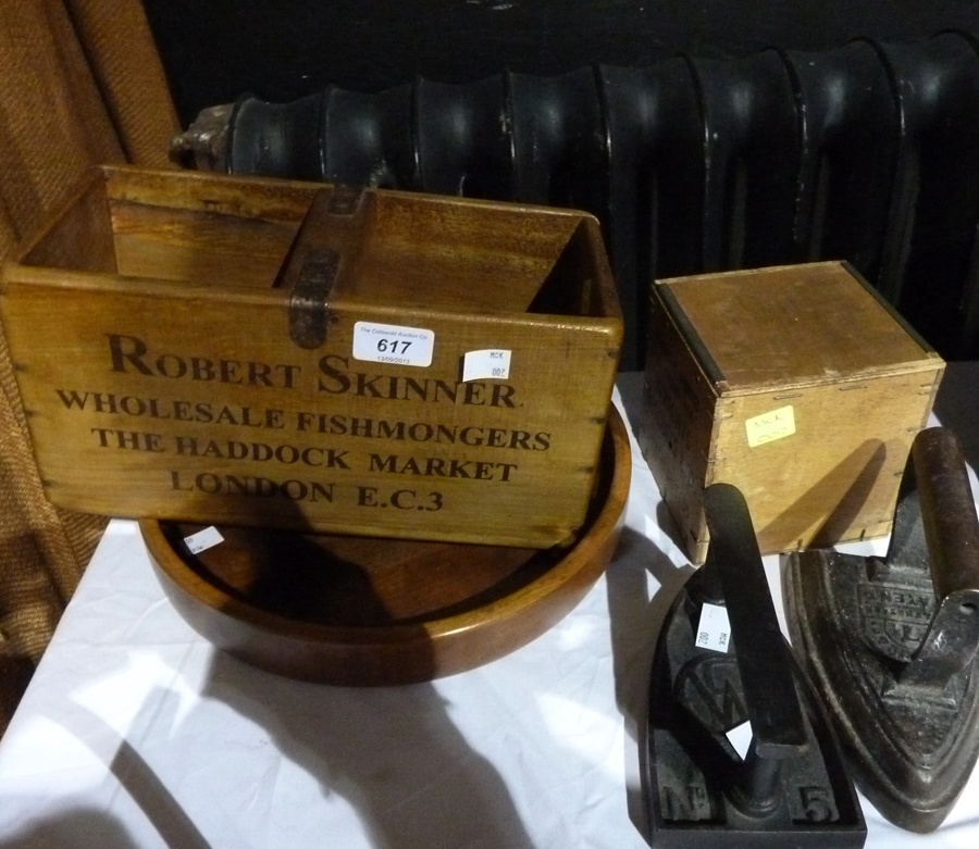 Two flat irons, Wrights biscuits tea caddy, two section bottle stand and a wooden circular dish