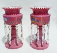 Pair of pink opalescent glass lustres, enamelled decoration, frilled edge, on circular bases,