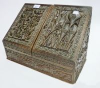 Oriental carved stationery rack, with relief mouldings of fruit and flowers, a brass inkwell and