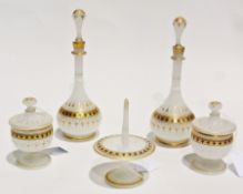 Opalescent glass dressing table set, gilt and black decorations, comprising two lidded pin jars, a