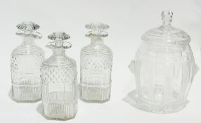 Three early nineteenth century matching cut glass decanters (af), 19cm high and a cut glass