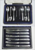 A set of six silver handled tea knives together with a set of six silver teaspoons with a matching