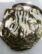 Silver sequin and beaded evening bag, containing a large collection of old pennies and halfpennies